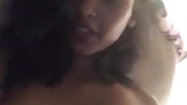 American Indian girl plays with her big pierced tits